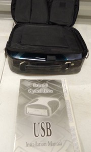 lot 213 image: QUE DRMIVE - External Optical DRIVE. used but in original package