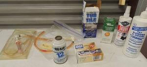 lot 234 image: Misc. lot Tear mender NIB, Skunk Spray, Tube and tile finish 2 pump