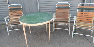 lot 242 image: Outside oval table with 3 fold up chairs very used