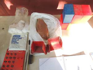 lot 33 image: Loading supplies- 6 plastic shell boxes, MEC E2 Pak x 2, Silicone gun and reel cloth, 1x1s x 1, PC reloading center organizer