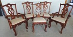 Georgian/Regency style custom order chairs. Carved pierced scroll back with Cabriole legs terminating with Claw and Ball feet. Upholstered seat. Carved shell apron and scroll accents. 2-Captains chairs with arms and 8 side chairs.