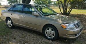lot 1 image: UPDATED INFO 2004 TOYOTA AVALON XLS IN RUNNING  SOLID OVERALL CONDITION AS SHOWN. ALL-LEATHER INTERIOR, SUNROOF, ORIGINAL CD CHANGER AUDIO SYSTEM, FULL SIZE SPARE TIRE, WATER PUMP AND TIMING BELT REPLACED RECENTLY. NO TAX ON THIS LOT