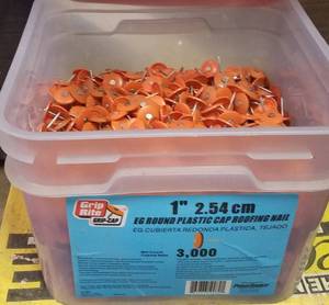 lot 149 image: BUCKET OF 1 PLASTIC CAP ROOFING NAILS AS SHOWN.