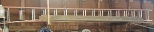 lot 164 image: LARGE ALUMINUM EXTENSION LADDER AS SHOWN. APPROX. 32FT (EXTENDED)