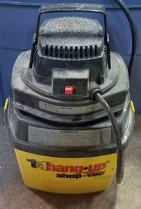 lot 207 image: 1X1 HANG UP SHOP VAC MODEL 500M AS SHOWN.
