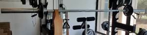 lot 5 image: BARBELL WITH WEIGHTS AS SHOWN. YOU ARE BIDDING ONLY ON THE BARWEIGHTS.