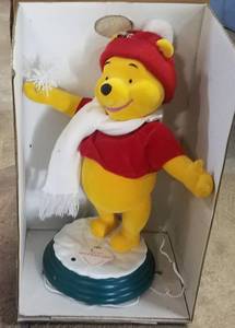 lot 252 image: WINNIE THE POOH FIGURE IN STYLECOLORCONDITION SHOWN.