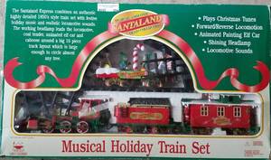 lot 294 image: SANTALAND TRAIN COLLECTION MUSICAL HOLIDAY TRAIN SET IN ORIGINAL BOX AS SHOWN.