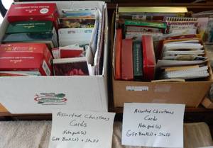 lot 580 image: 2 BOXES OF CHRISTMAS CARDS, NOTEPADS, GIFT BOOKS PLUS NAME TAG SUPPLIES AS SHOWN. YOU ARE BIDDING BY THE BOX