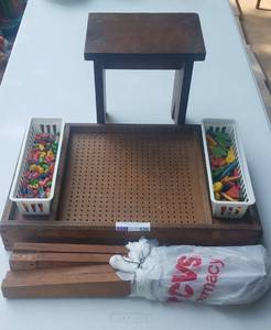 lot 520 image: VINTAGE CHILD DESKACTIVITY STATION WITH PEG BOARD TOP AND ORIGINAL WOOD PEGS AND WOOD STOOL AS SHOWN. MUST SEE