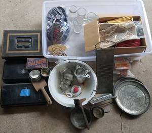 lot 688 image: VINTAGE KITCHEN ITEMS AND MORE AS SHOWN INCLUDING PLATES, MEAT TENDERIZER, CHEESE GRATER, COOKIE CUTTERS, AND MORE AS SHOWN. TAKE A LOOK