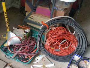 lot 702 image: EXTENSION CORD, PORTABLE LIGHT, JUMPER CABLES AND MORE AS SHOWN.