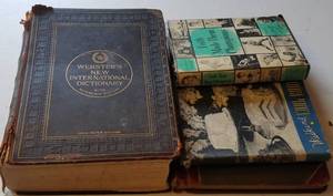 lot 752 image: 1917 WEBSTERS DICTIONARY PLUS VINTAGE BOOKS AS SHOWN.