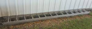 lot 703 image: ALUMINUM EXTENSION LADDER AS SHOWN. APPROX. 24 FT EXTENDED.