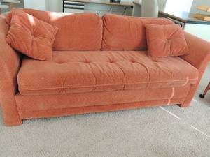 lot 2 image: Simmons Hide-a-Bed Sofa Rust color  1 large cushion and 2 small throw pillows