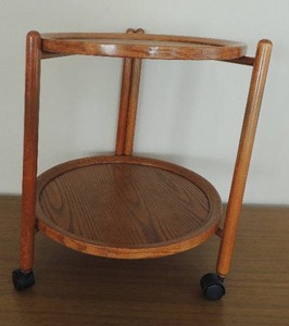 lot 15 image: Rolling Serving Cart   HAS  2 - 19 oval serving trays removable, tray folds up 22 x 18, MISSIMG 1 wheel