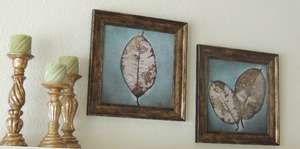 lot 33 image: TWO LEAF  ART  15x15 and   Matching Set OF GOLD ORNATE CANDLE HOLDER (3 HOLDERS)