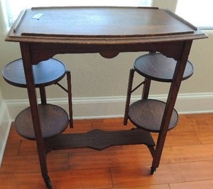 lot 50 image: Antique DESSERT CART  SERVING CART- HAS 4 CIRCULAR  PLATFORMS  on wheels 25x30
