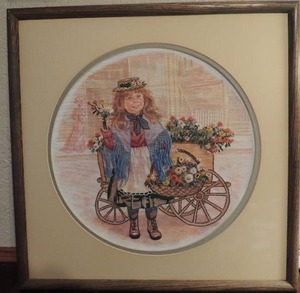 lot 59 image: Needlepoint- Girl selling flower framed 19x19