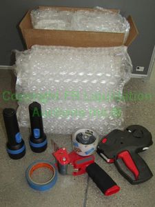 lot 51 image: Various shipping supplies, including bubble wrap, flashlights and more