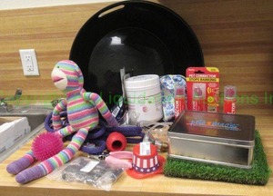 lot 131 image: Various pet items, including dog toys, Pet Corrector cans, and more