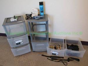 lot 67 image: Mainstays plastic storage drawers and various pet grooming supplies, including Oster hair trimmer, brushes and more