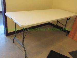 lot 69 image: Staples plastic folding table, 29 x 71 x 29