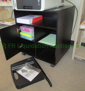 lot 58 image: Storage cabinet and various office supplies, including paper cutter, paper and more