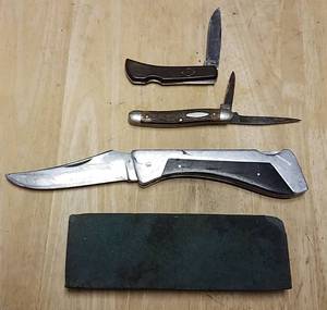 lot 173 image: 3 pocket knives and a whetstone