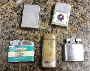 lot 194 image: 4 vintage lighters and a match case