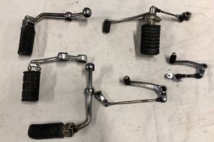 lot 142 image: Motorcycle foot pegs and shifter