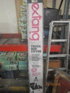 lot 207 image: EXTANG TRUCK BED COVER 3940 SABER TONNO CHEVYGM SILVERADOSIERRA SB NEW IN BOX