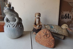lot 167 image: Yard Art- Welcome stone plastic, prince frog on ball plastic, duck, meditation dog on stump