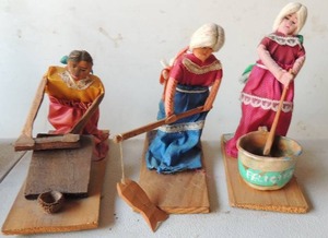 lot 171 image: 3 wooden vintage ladies - fishing for dinner,  using board for clothes,  cooking in pot outside 5x5x2