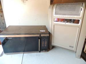 lot 183 image: Space saver Tappan microwave unknown working condition  Lasco electric heater