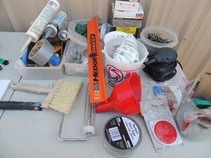 lot 191 image: Misc. lot-nails, screws, tile adhesive caulking, tape, door hinges, palm sander  and more