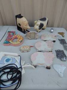 lot 192 image: Piggy lot- picture frame, 2 mold, wind chime, book ends and more