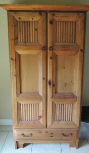 lot 150 image: Light brown Cabinet  (wood burn look) double front doors 1 drawer at the bottom, 4 shelves 69x38x18