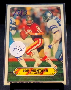 lot 44 image: JOE MONTANA 49ERS 1983 TOPPS STICKER #21 NM