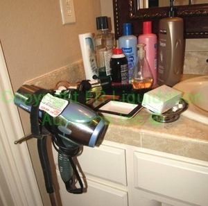 lot 23 image: Assorted beauty supplies including hair dryer and stand plus as shown