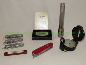 lot 144 image: Zippo aircraft money clip knife and other pocket knives plus