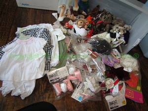 lot 65 image: Assorted doll clothes and more as shown