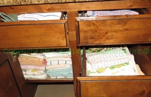 lot 379 image: Assorted dish towels contents of 4 drawers