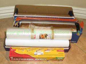 lot 360 image: Large rolls of parchment paper and plastic wrap