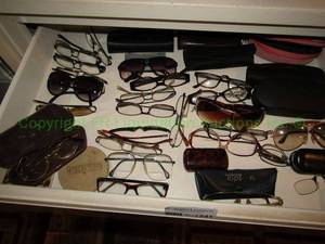 lot 241 image: Contents of 4 drawers including Assorted reading & sun glasses plus cases and more