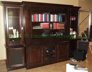lot 425 image: Unique bookcaseTV entertainment center. Center section rotates with book shelf on one side and TV section on other