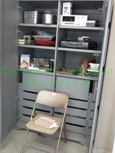lot 440 image: Contents of storage cabinet including electronics, pans and more as shown