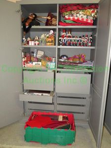 lot 442 image: Contents of cabinet Assorted Christmas decor including nutcrackers and more as shown