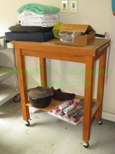 lot 446 image: Solid oak utility table 30 x 18 x 35 plus contents, cast iron stew pot, towels and more as shown