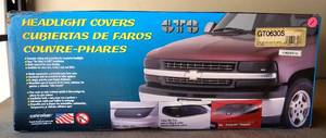 lot 1 image: DODGE RAM FULL SIZE - 2004 ON  HEADLIGHT COVERS - APPEARS UNUSED IN ORIGINAL BOX